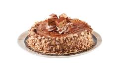 Single layer cake topped with Coffee Crisp spread, chocolate whip and candy bar crumbs on a white plate.