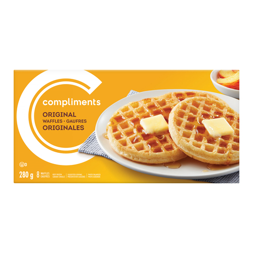 A yellow cardboard Compliments Original Waffles box, depicting two toasted waffles dressed with maple syrup and butter on a white plate
