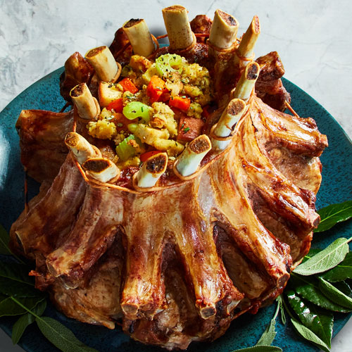 crown roast pork on a blue serving platter