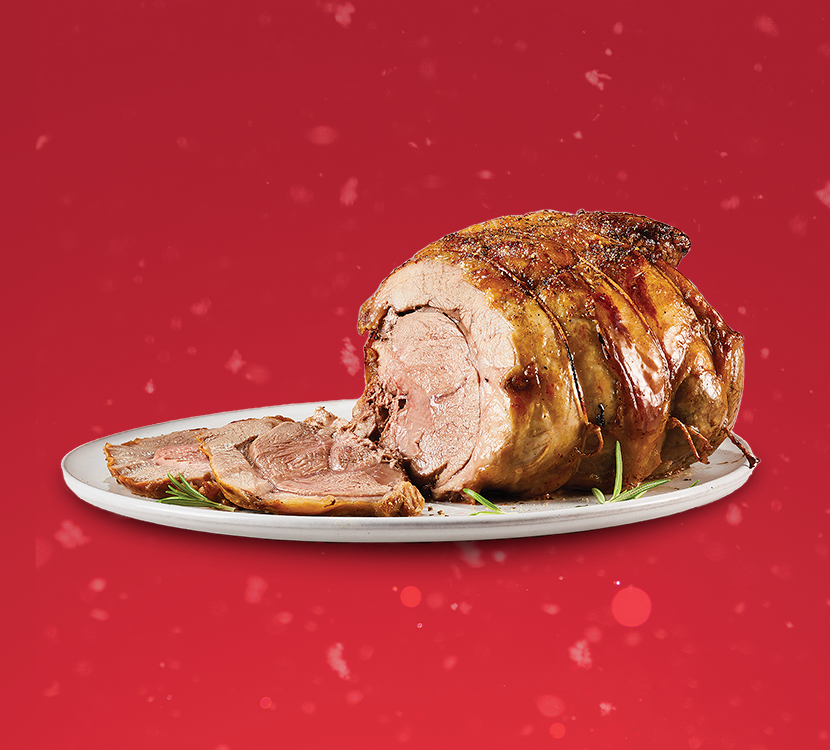 Boneless lamb leg roast on red background